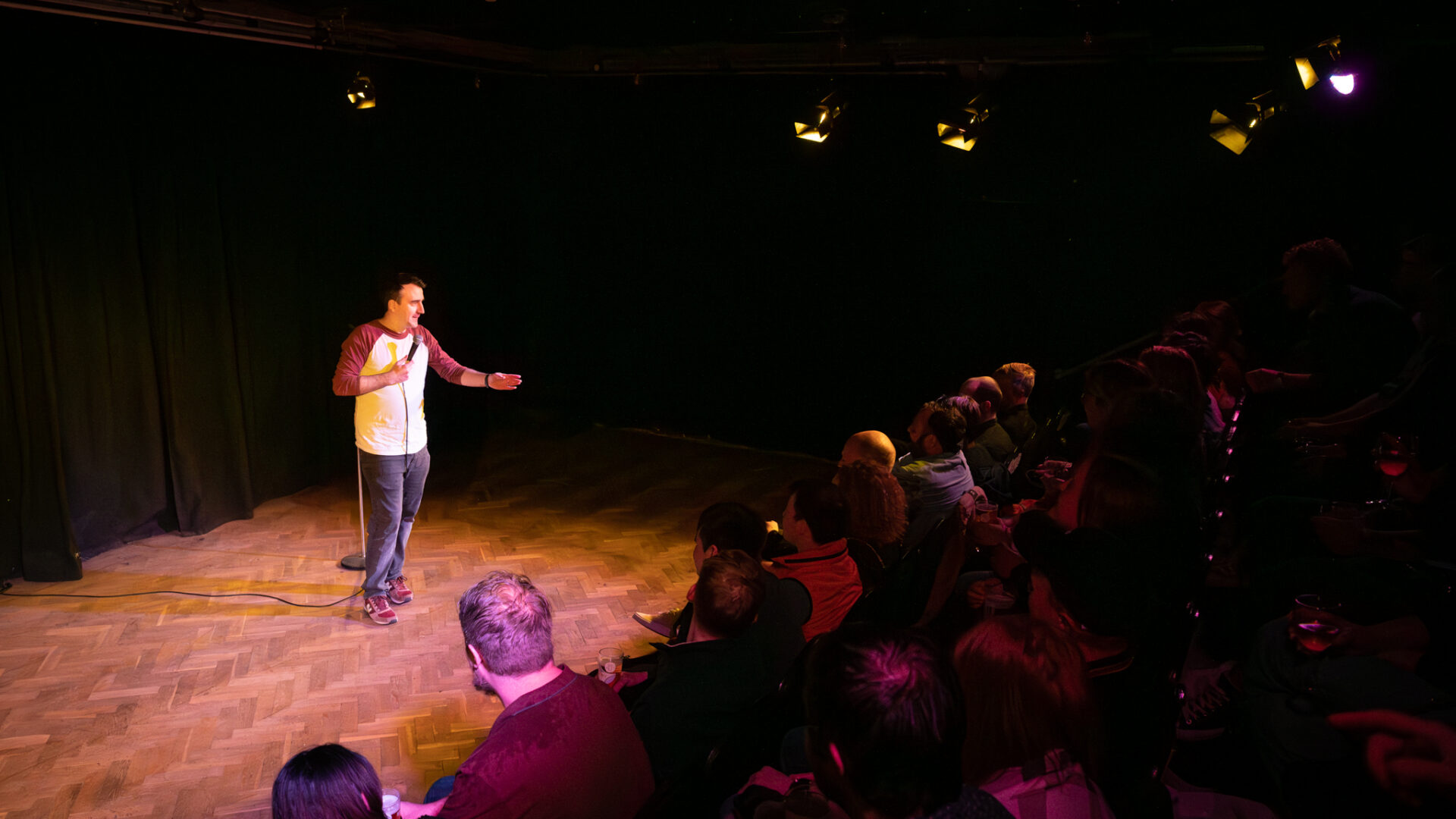 a stand-up comedian performing in front of an audience